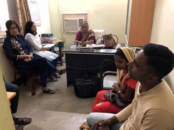 A group of people sitting around in a room.