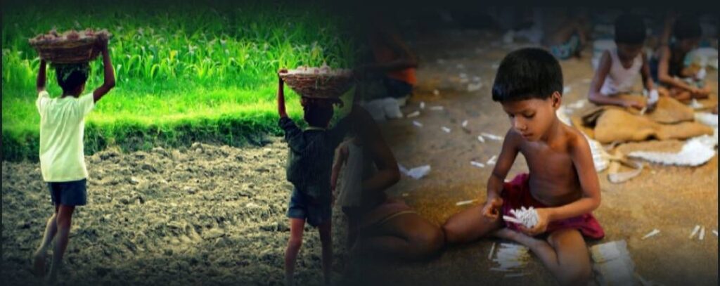 A person holding something in their hand while sitting on the ground.