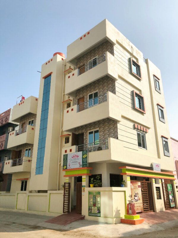 A building with many windows and doors on the outside.